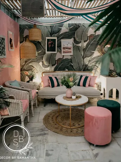 This shot captures the complete look of the retro lounge, with its mix of vintage-inspired furniture, tropical plants, and personal touches that made the space unique to the couple.