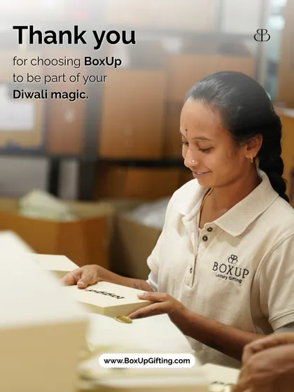 Thank you for choosing BoxUp to be part of your Diwali magic. A smiling team member proudly holds a freshly packed gift box, representing the care we put into every order.