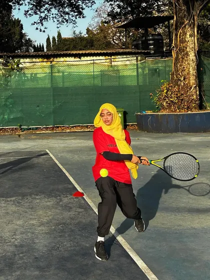 One of our players mid-swing, demonstrating excellent form and focus during a training session on the court.