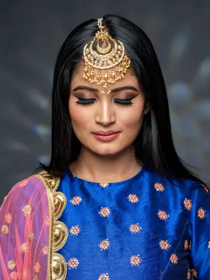 A beautiful close-up of the actor's makeup. The smokey eye is the star of the show, perfectly blended to create a look of intense glamour.