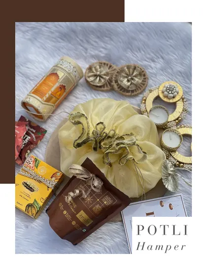 A traditional and charming Potli Hamper for Diwali. This beautiful yellow potli is filled with festive treats like brownie chips, dhoop sticks, and decorative tea lights.