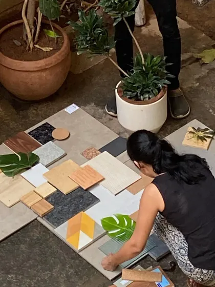 Our team and clients gather in the studio courtyard to create a material palette. This hands-on, collaborative session is a crucial part of our design process, ensuring the final home reflects the client's personal style.
