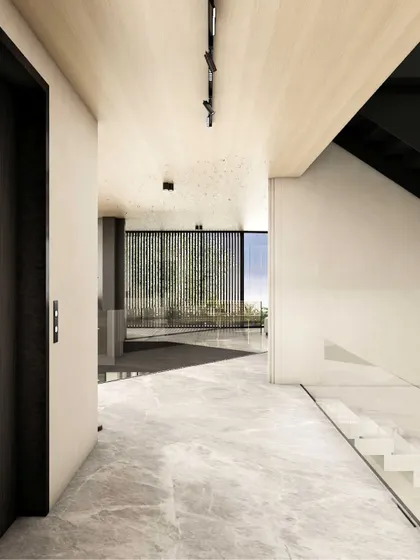This corridor is a study in balance between openness, materiality, and geometry. Light grey marble flooring and a light wood ceiling create a refined foundation, while black metal details and full-height glass panels provide structure and visual continuity.