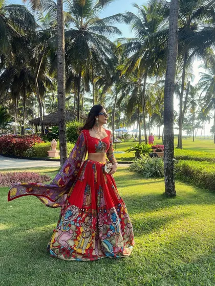 A vibrant, printed lehenga for a destination wedding. The bright colours and lightweight fabric are perfect for a festive, outdoor setting.