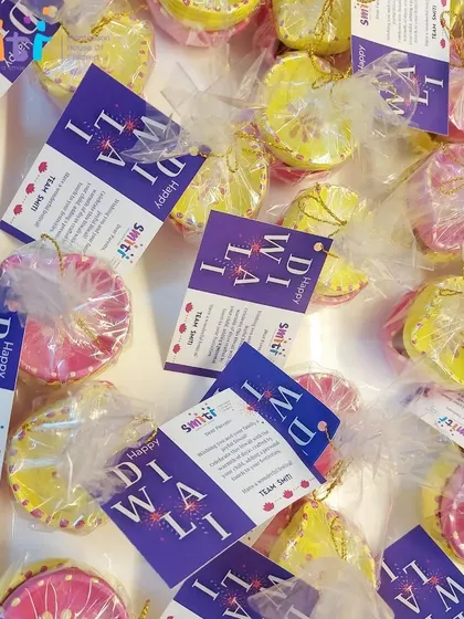 The finished diyas are beautifully wrapped and tagged, ready for the children to gift to their families. This completes the cycle of creating and giving.