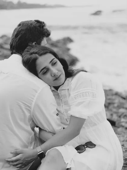 A tender embrace captured in beautiful black and white. This artistic choice strips away distractions and focuses the viewer's attention on the intimacy of the moment.