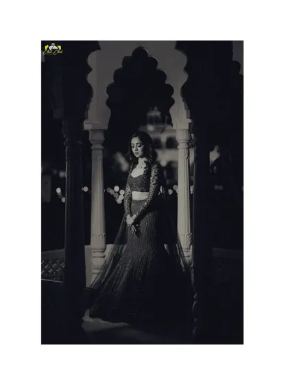 A dramatic black and white portrait of the bride, using light and shadow to create a timeless and artistic image before her sangeet.