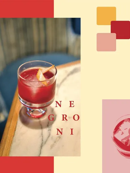 The Negroni, a timeless Italian aperitivo, is a cornerstone of our bar program. This image showcases our classic preparation, balancing Gin, Campari, and Vermouth over a large ice cube for a perfectly bitter and complex cocktail.