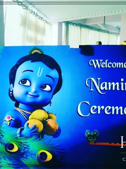 A custom welcome sign for a Naming Ceremony, featuring a lovely illustration of baby Krishna. These personalized touches make the event special from the moment guests arrive.