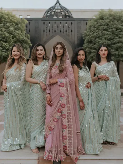 The bride with her beautifully coordinated bridesmaids at a destination wedding in Dubai. This elegant group portrait showcases the style and grace of the bridal party.
