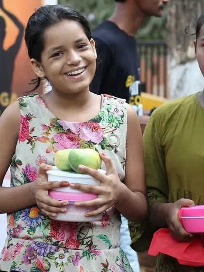 Young children receiving nutritious meals through our Annam Brahma initiative. We are dedicated to nurturing health and spreading compassion, one meal at a time.