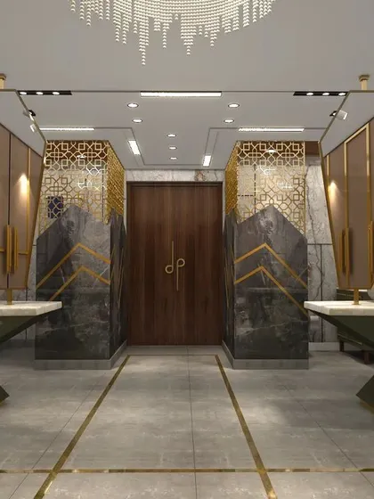 The design features a walk-in wardrobe area with dull gold finishes, seamlessly integrated with the washroom space.