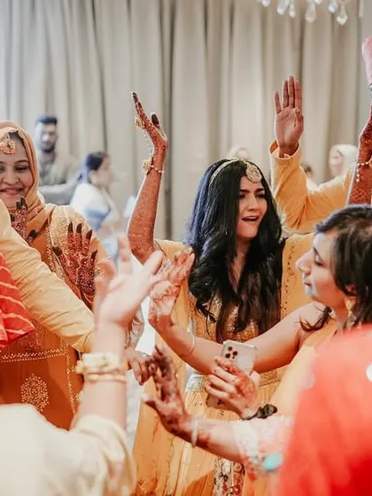 The energy of the dance floor, as the bride and guests celebrate together at the Sangeet.