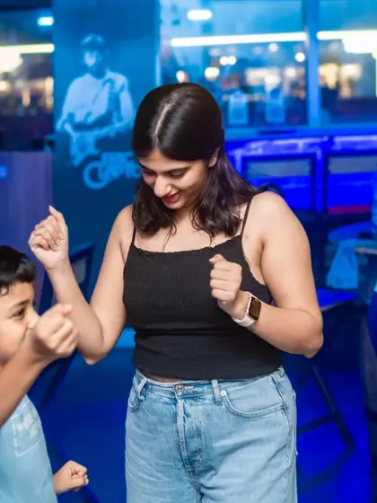 A mother and son sharing a dance. It's heartwarming to see families enjoying the music and atmosphere together.
