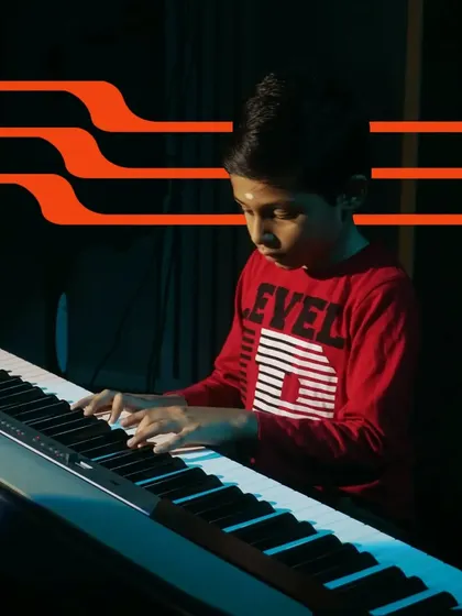 A young student demonstrates his progress on the piano. Our goal is to nurture talent from a young age and watch our students grow into confident musicians.