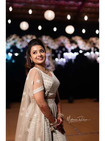 Ashwini looking stunning under the stage lights at her Sangeet.