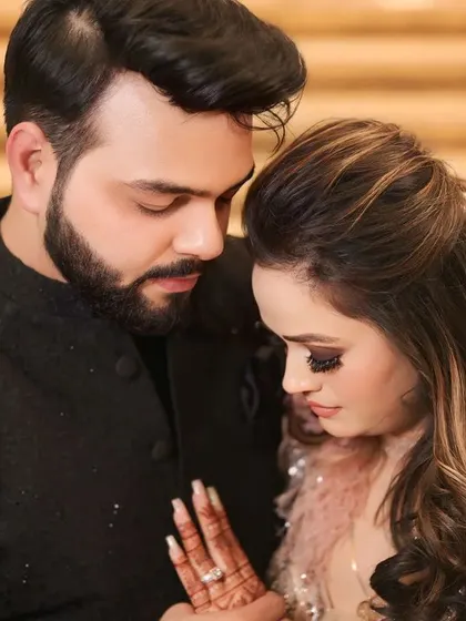An intimate portrait capturing the couple in a quiet, shared moment. The focus is on their connection, making it a timeless memory of their engagement day.