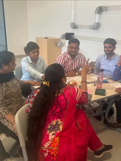 A diverse group of male and female educators collaborating during a workshop. My sessions bring together teachers with different backgrounds to share their unique perspectives.