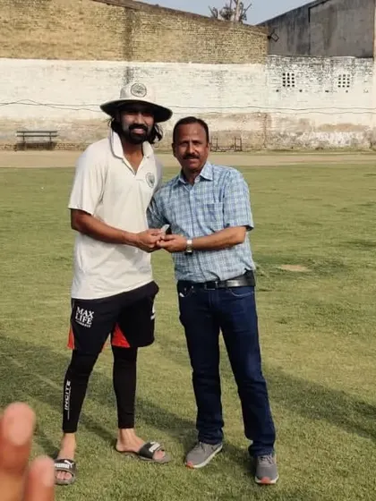 Teammates applaud as Mohit Kalyan receives his award for an excellent unbeaten score of 124, which led the team to a last ball victory against Delhi Colts.