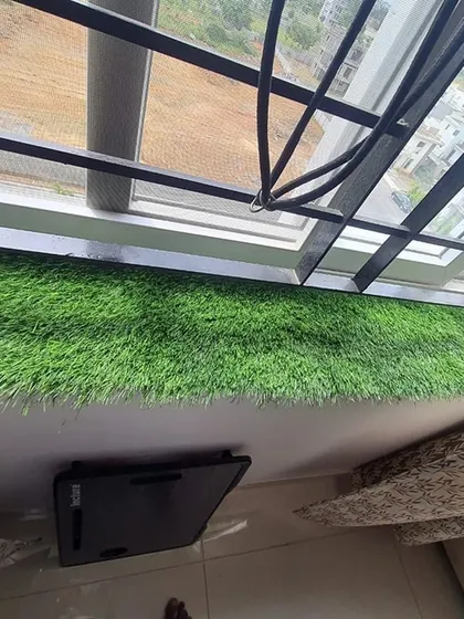 Artificial grass can even be used on window sills or ledges to add an unexpected touch of green.