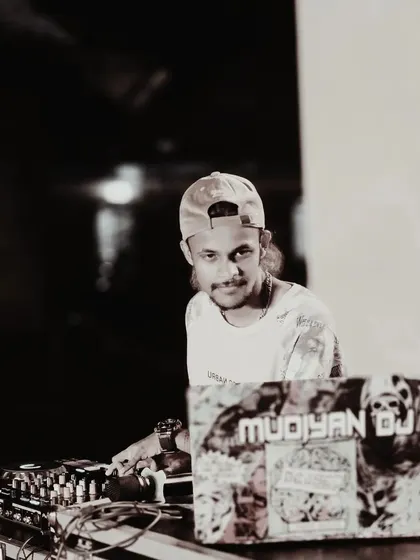 A sepia-toned shot of me at the decks, looking at the camera.