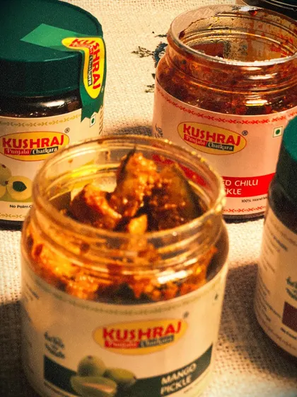 A closer look at the texture of my homemade Mango Pickle, with other varieties like Red Chilli and Amla in the background.