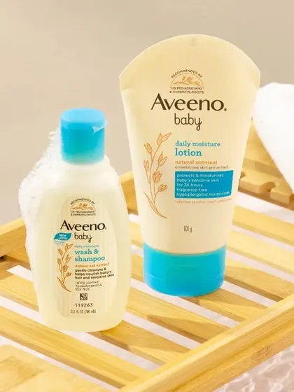 We created a mini bathroom set in the studio for this Aveeno Baby shot. The products are placed on a wooden bath caddy over a tray of water, creating a realistic and serene bathtime scene.