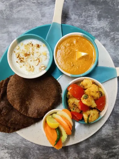 My special Navratri thali, prepared without onion or garlic. It includes vrat-friendly dishes like Kuttu ki Puri, Aloo Sabzi, and Makhane ki Kheer.