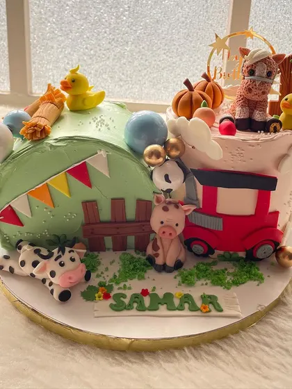 A fun take on the farm animal theme, with a train full of cute critters. This cake combines a love for animals and trains into one delightful design.