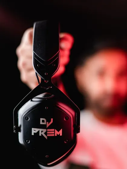 My custom DJ Prem V-MODA headphones. For me, professional-grade equipment is essential for delivering the best sound quality and a seamless music experience at every gig.