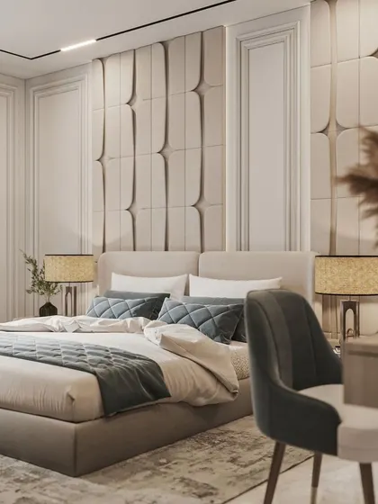 A different angle of the bedroom with the 3D-paneled wall, showing its texture and interplay with light.