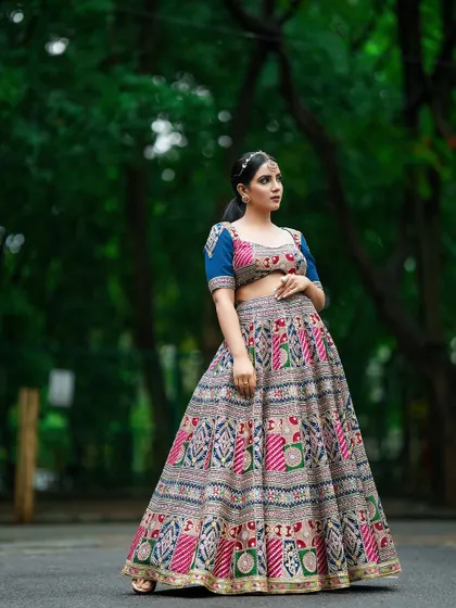 A poised, full-length shot that presents the ethnic wear in a classic, elegant stance, perfect for a catalogue's main page.