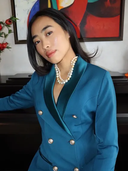 A full view of the layered pearl necklace, styled with a modern blazer to show its versatility. Real pearls and real craftsmanship are the foundation of my work.