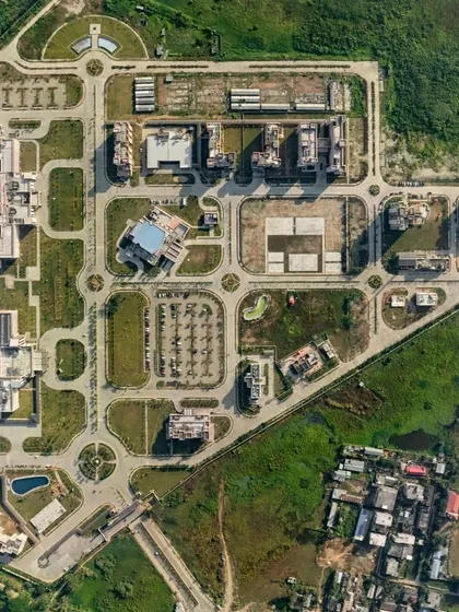Our design for AIIMS Guwahati is centered on empathy for people and the planet. Situated along the Brahmaputra, the site-responsive design integrates vernacular drainage systems like ponds and swales to mitigate flood risks and preserve the local ecosystem.