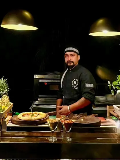 Our chef stands ready at a live pizza station, equipped with fresh ingredients and a professional oven. This station is a fantastic way to offer guests hot, customized pizzas throughout your event.
