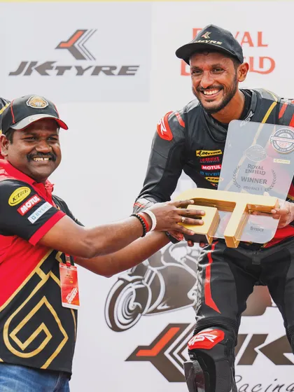 Receiving the trophy for winning the Pro Race 1 in the Royal Enfield GT Cup. It's an honor to compete and succeed in such a challenging one-make championship series.