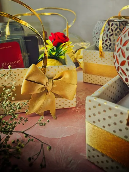 A closer look at the details in the friendship gift baskets, including a small artificial rose and a beautiful bow. It's these little touches that make a gift feel special.