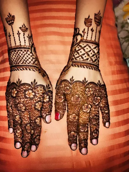 The same festive design, showing the rich color of the henna paste.