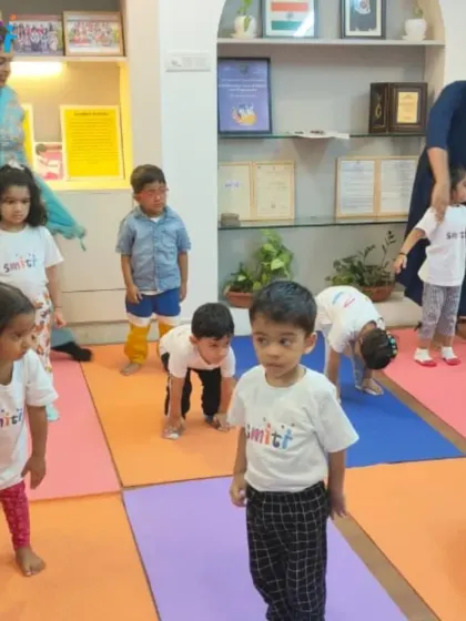 Our toddlers participate in a yoga session, learning simple poses like the cat-cow stretch. It's never too early to introduce the benefits of mindfulness and movement.