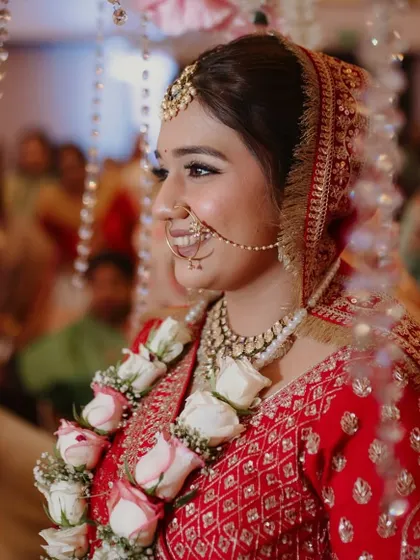 A candid shot of the bride during her ceremony. The makeup is designed to look beautiful in professional photos, with a soft-focus finish that glows.
