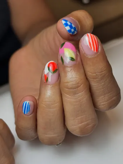 The full view of the playful "fruity nails" set. It's a perfect example of a fun, mix-and-match manicure that's full of personality.