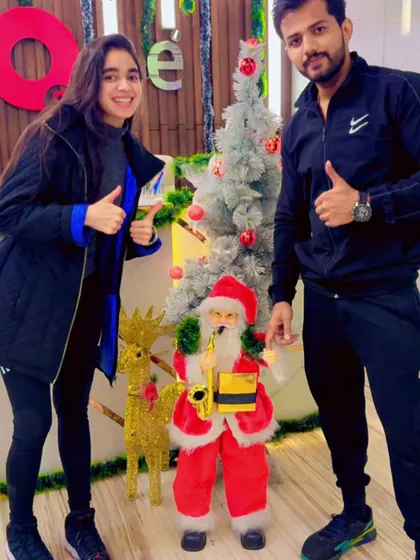 Thumbs up for the holiday season. Our members enjoying the Christmas decorations and festive spirit at the front desk.
