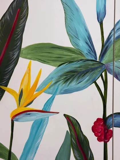 A close-up of the bird of paradise flower and other botanicals from the crockery unit mural. I love using bright, contrasting colors to make the design pop.