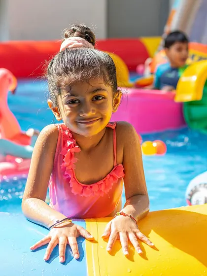 A smiling guest enjoying the cool water of our inflatable pool. It's the perfect way to spend a hot Delhi afternoon.