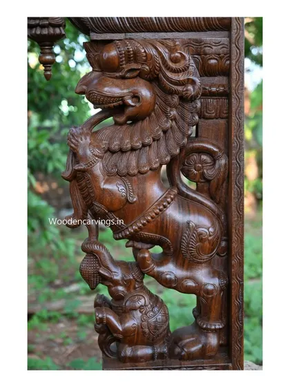 Another angle of the Yaali bracket, showing the fine lines and textures carved into the wood to depict the creature's mane and muscles.