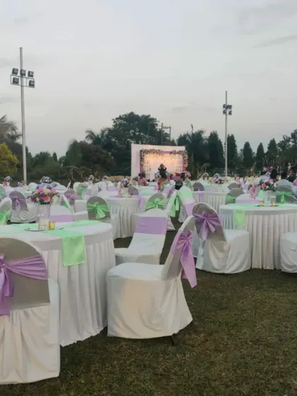 We cater to celebrations of all sizes. This is a glimpse of an elegant outdoor wedding reception we catered at the ASC Centre, with beautiful decor and seating for a large number of guests.