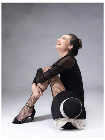 The best portraits capture a feeling. This image is all about the pure, uninhibited joy that comes from feeling completely at ease and celebrated in front of the camera.