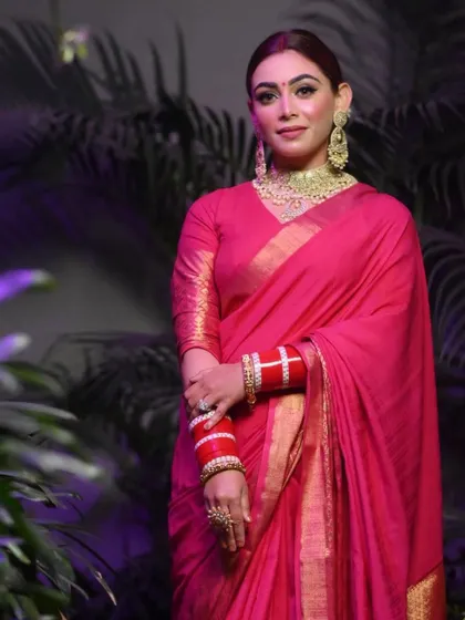A stunning party look in a bright pink saree. I created a classic look with smokey eyes and traditional red bangles.