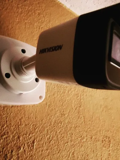 A close-up of a professionally mounted Hikvision bullet camera. We use durable, weatherproof cameras designed for outdoor use to ensure clear footage and reliable performance in all conditions.