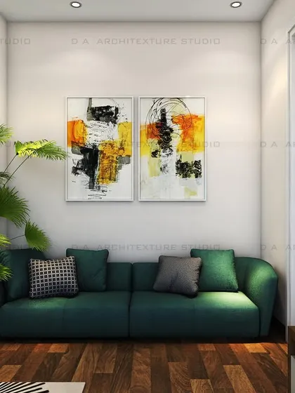 A close-up of the seating area, with vibrant abstract art that complements the green sofa.